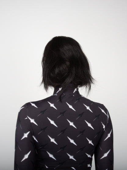 Female model back view close-up of Manhattan graphic print on fitted jersey top bodysuit by VinöniV / VinoniV