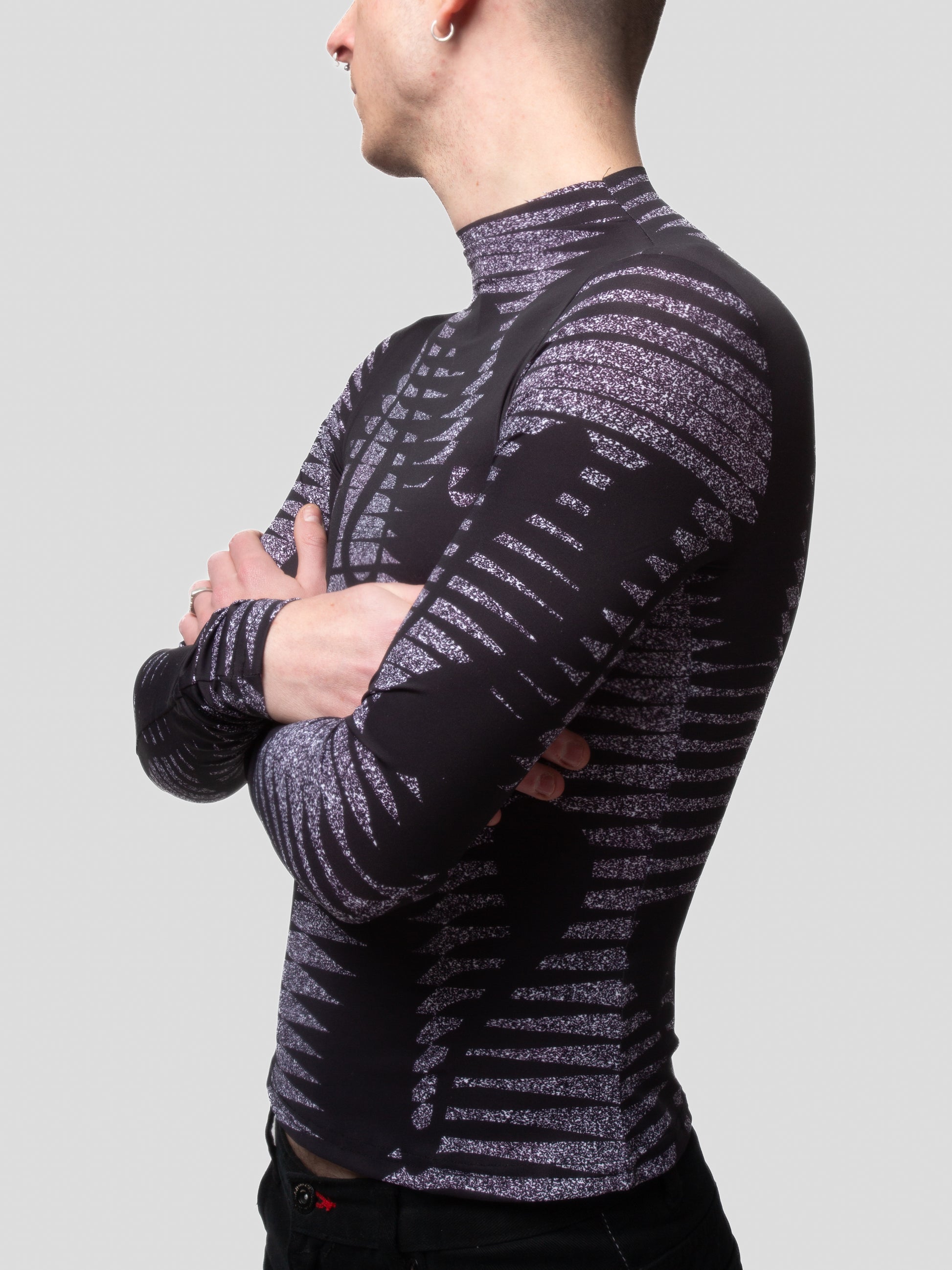 Close-up of male model wearing VinöniV / VinoniV Noise fitted printed bodysuit jersey top in semi-purple color